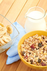 Delicious and healthy cereal in bowl with milk