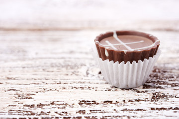 Dark chocolate on wooden background