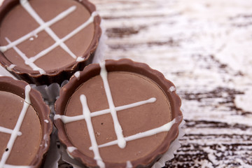 Dark chocolate on wooden background