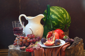 Wine, grapes, a pomegranate, a fig, a water-melon and a white ju