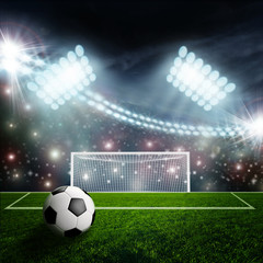 Soccer ball on green stadium arena