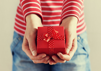 woman hands holding a gift or present box.