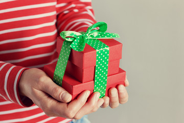 woman hands holding a gift or present box.