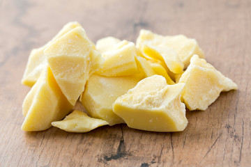 cocoa butter isolated on wooden surface