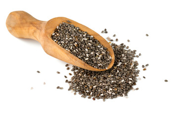 chia seeds in a wooden scoop isolated on white