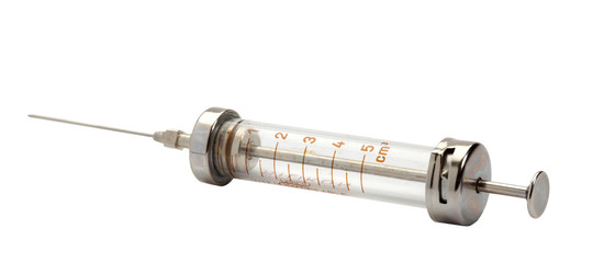 Old syringe isolated on white. Clipping path .
