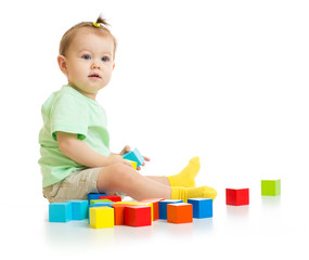 baby playing with colorful blocks isolated