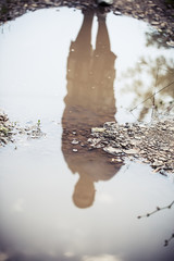 silhouette in a puddle