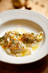 Boiled dumplings filled with mushrooms and cabbage