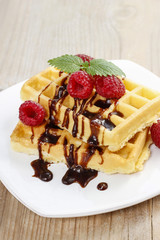 Waffles with chocolate and raspberries