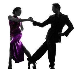 couple man woman ballroom dancers tangoing  silhouette