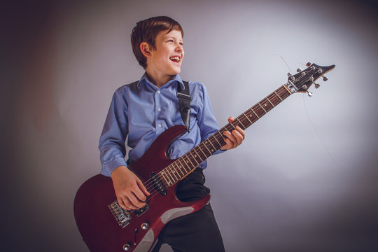 teenager boy of 10 years European appearance smiles plays gui