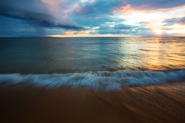 Fototapeta na wymiar Beach Water in Motion at Sunset