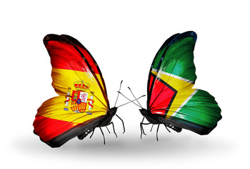Two butterflies with flags Spain and Guyana