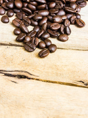 Coffee beans on wood background