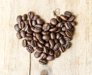 coffee beans love heart shape on wooden floor