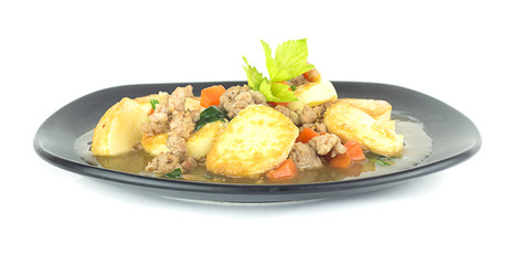 Stir fried tofu with pork and carrot on white