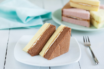 pieces of chocolate and butter chiffon cake on plate