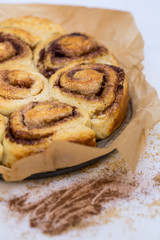 prepared cinnamon buns in brown paper