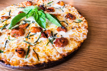 Traditional Italian pizza on wooden board