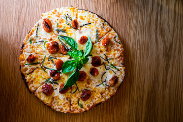 Traditional Italian pizza on wooden board