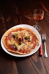 Pizza with artichokes and bacon