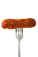 Grilled sausage on a fork