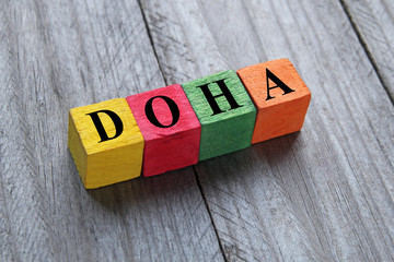 word Doha on colorful wooden cubes