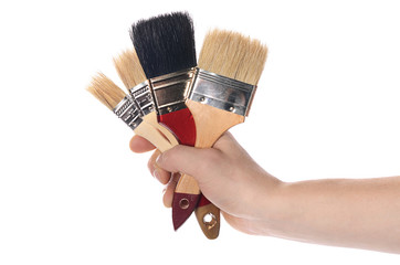 Whitewashing brush in a man's hand