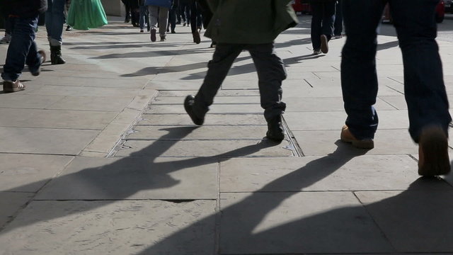 Legs of people on walking on Regent Street in London