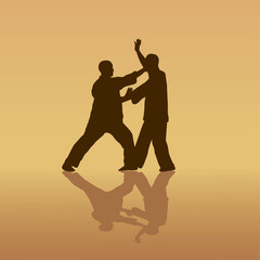 Fototapeta na wymiar Two men are engaged in the Kung fu on a yellow background.
