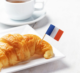 Cup of coffee and croissant in Paris