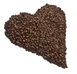 Coffee beans aligned to shape a heart.
