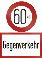 Old design (1956) of a German speed limit sign with additional sign warning about Gegenverkehr/oncoming traffic