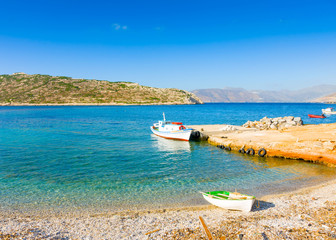 Old fishing boats by the sea in Amorgos island in Greece