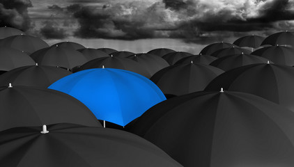 Leadership concept of a blue umbrella different from the rest - 76333899