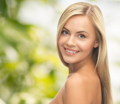 face of beautiful young happy woman with long hair