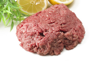 Minced horse meat with spice on the white