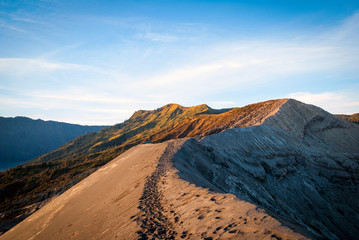 Fototapeta na wymiar The edge of volcanic crater of Bromo, Indonesia