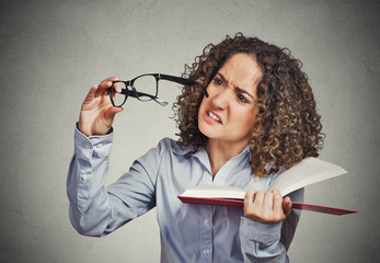 woman can't see read book has vision problems wrong glasses
