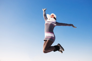 Portrait of happy young woman have fun at beautiful sunny winter