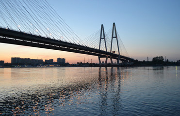Cable-braced bridge before dawn.