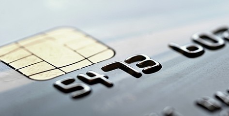Chip of the gray credit card, closeup shot. Closeup of old credit card. Close up of chip for secure payment.