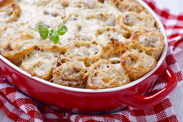 Baked crepes roll with chicken and cheese