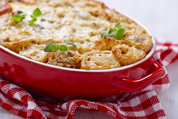 Baked crepes roll with chicken and cheese
