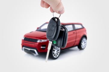 Hand holding keys to new car. Buy or selling business compositio
