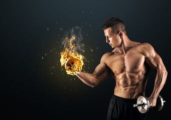 Muscular man with dumbbells on dark background