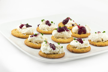 Obraz na płótnie Canvas Crackers with Cream Cheese Grape Jelly and Chives
