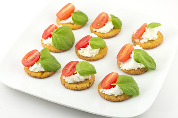 Crackers with Cheese Tomato and Basil