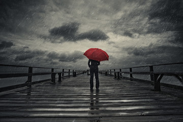 Red umbrella in storm - obrazy, fototapety, plakaty